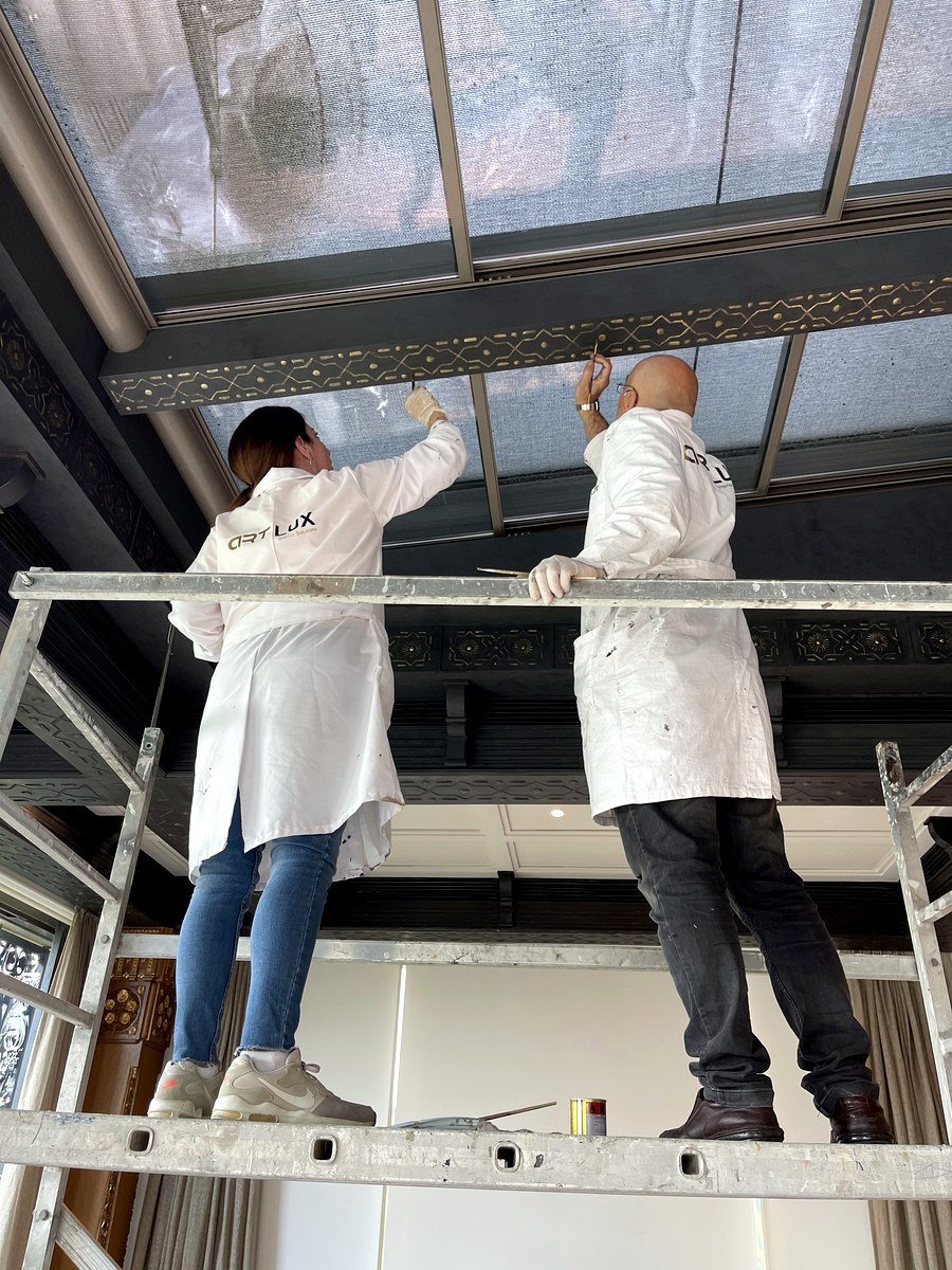 Artisans working on a ceiling on site